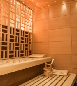 vertical-shot-beautiful-sauna-room-design-with-wall-tiles-wooden-bench